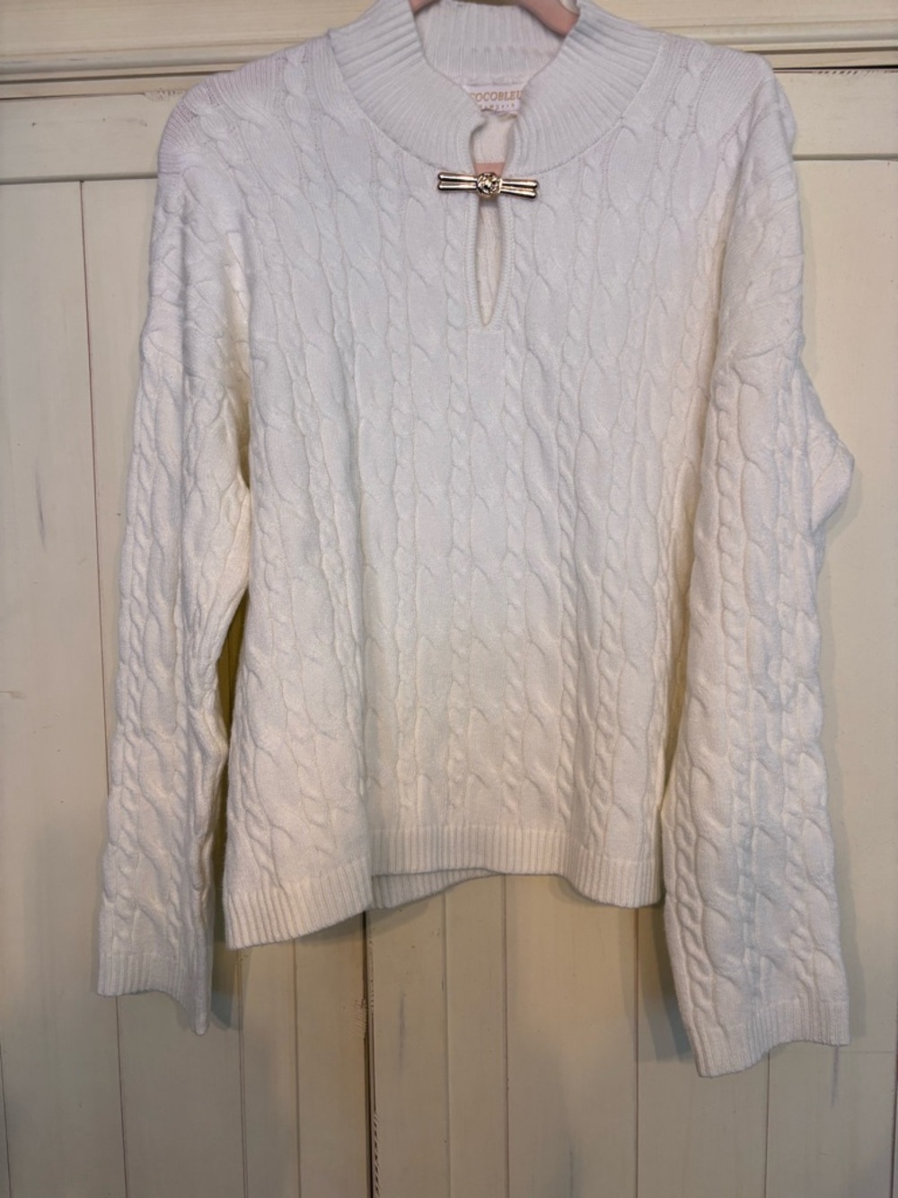 Cocoblue Cream Cable-Knit Sweater with magnetic Bow Accent.